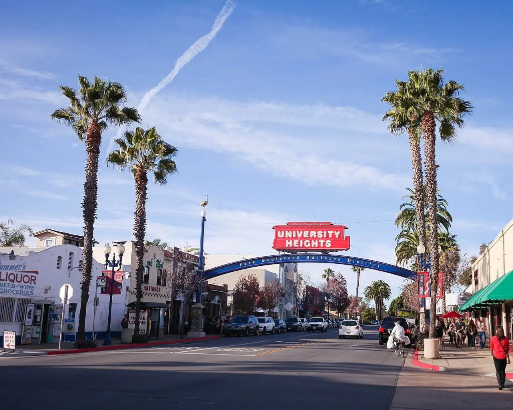 University Heights neighborhood arch and trolley sign over Park Boulevard, San Diego.